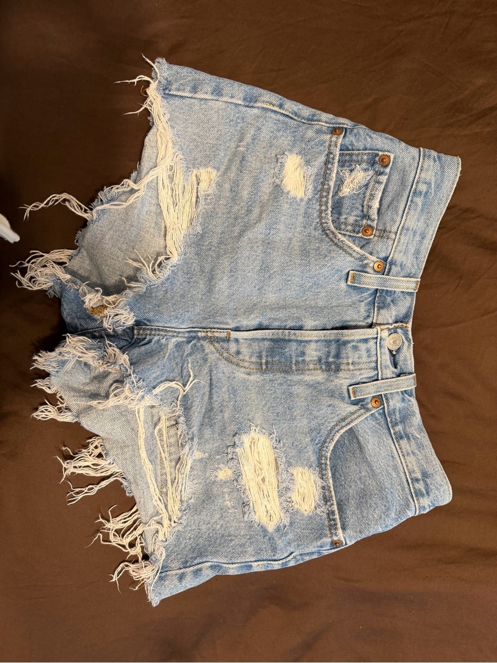Levi's light wash denim shorts with frayed hem